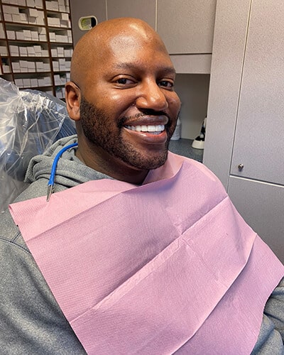 Daryl one of our Uptown Dental patients smiling after his treatment