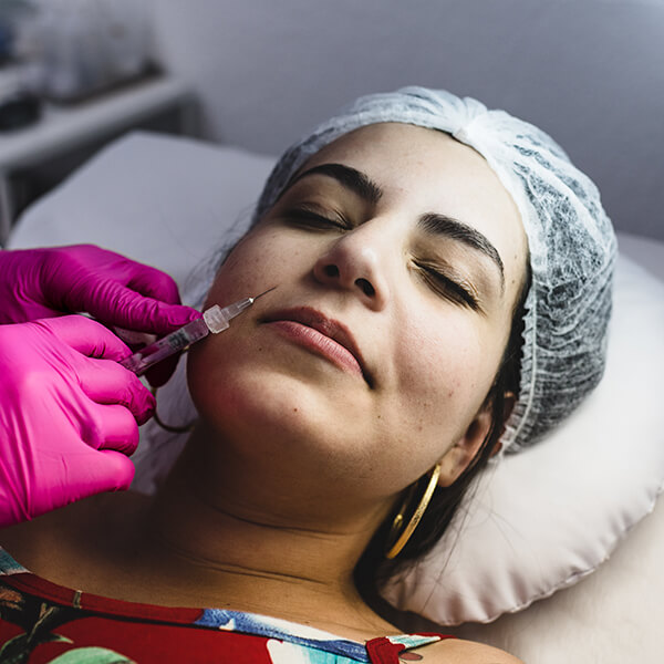 PRF being injected into the face of a female patient